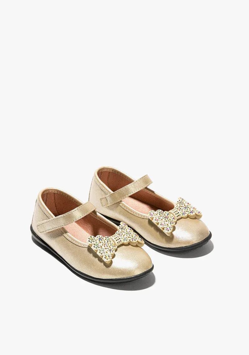 Gold leather mary janes with bow